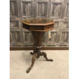 VICTORIAN WALNUT OCTAGONAL NEEDLEWORK TABLE the hinged top revealing a fitted interior,