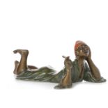 IN THE MANNER OF BERGMAN - COLD PAINTED BRONZE FIGURE OF AN ARAB modelled recumbent on his front