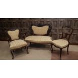 EDWARDIAN MAHOGANY THREE PIECE PARLOUR SUITE OF ROCOCO DESIGN comprising two seat sofa and two