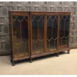 MAHOGANY DWARF BREAKFRONT BOOKCASE of George III design, the cornice with knulled border,