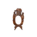 EARLY 19TH CENTURY WOODEN NOVELTY MIRROR FRAME modelled as a town crier holding a bell and a scroll,