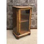 VICTORIAN WALNUT CROSSBANDED MUSIC CABINET with three interior shelves enclosed by a single glazed