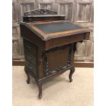 EDWARDIAN MAHOGANY DAVENPORT WRITING DESK of Rococo design,