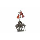 ART DE FRANCE BRONZED SPELTER FIGURAL TABLE LAMP modelled as a knight leaning down from his steed