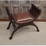MAHOGANY 'X' FRAME DRESSING STOOL with a padded upholstered seat in brown leather,