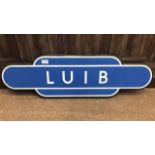 SINGLE SIDED RAILWAY SIGN FOR LUIB STATION with white lettering on a sky blue ground within a