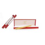 CARTIER 'VENDOME' BALLPOINT PEN serial number 102908, engine turned, gold plated body, 13cm long,