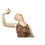 ROYAL WORCESTER FIGURE OF A CLASSICAL MAIDEN modelled leaning against a tree stump caressing a dove,