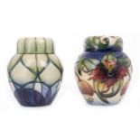 MOORCROFT 'ANNA' PATTERN GINGER JAR AND COVER tube-lined with lilies on a graduated blue ground,