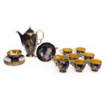 CROWN DEVON COFFEE SERVICE decorated with floral sprigs in enamel colours, on a powder blue ground,