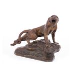 THOMAS CARTIER - GILDED BRONZE OF A PANTHER standing in an aggresive pose on a rocky outcrop,