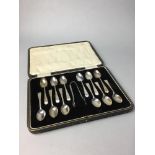 A SET OF SILVER SPOONS AND TONG