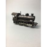 A BING O GAUGE 0-4-0 LIVE STEAM LOCOMOTIVE WITH TENDER