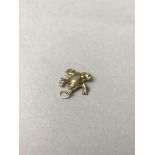 A GOLD FROG CHARM