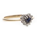 A HEART SHAPED BLUE GEM AND DIAMOND CLUSTER RING