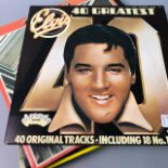 A LOT OF RECORDS INCLUDING EXAMPLES BY ELVIS AND THE BEATLES