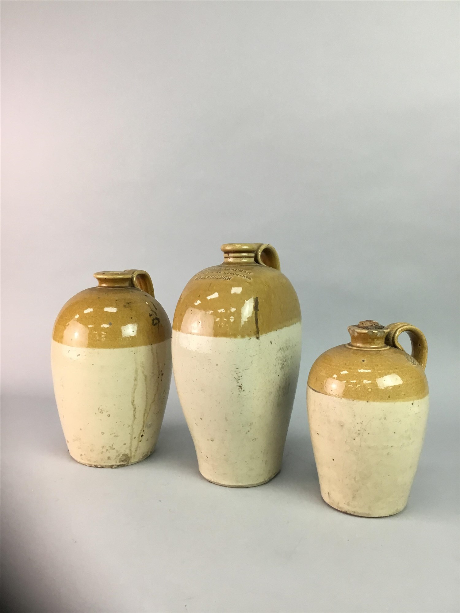 A LOT OF STONEWARE FLASKS INCLUDING A VICTORIAN EXAMPLE