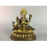 AN EASTERN COPPER AND BRASS MODEL OF GANESH