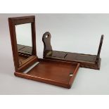 A MAHOGANY CAMPAIGN MIRROR AND AN EXPANDING BOOK RACK