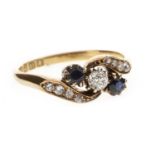 A DIAMOND AND BLUE GEM SET RING