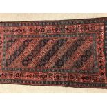 A CAUCASIAN BORDERED RUG