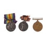 A SOUTH AFRICA MEDAL WITH TWO CLASPS ALONG WITH TWO WWI MEDALS