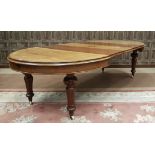 A VICTORIAN MAHOGANY EXTENDING DINING TABLE