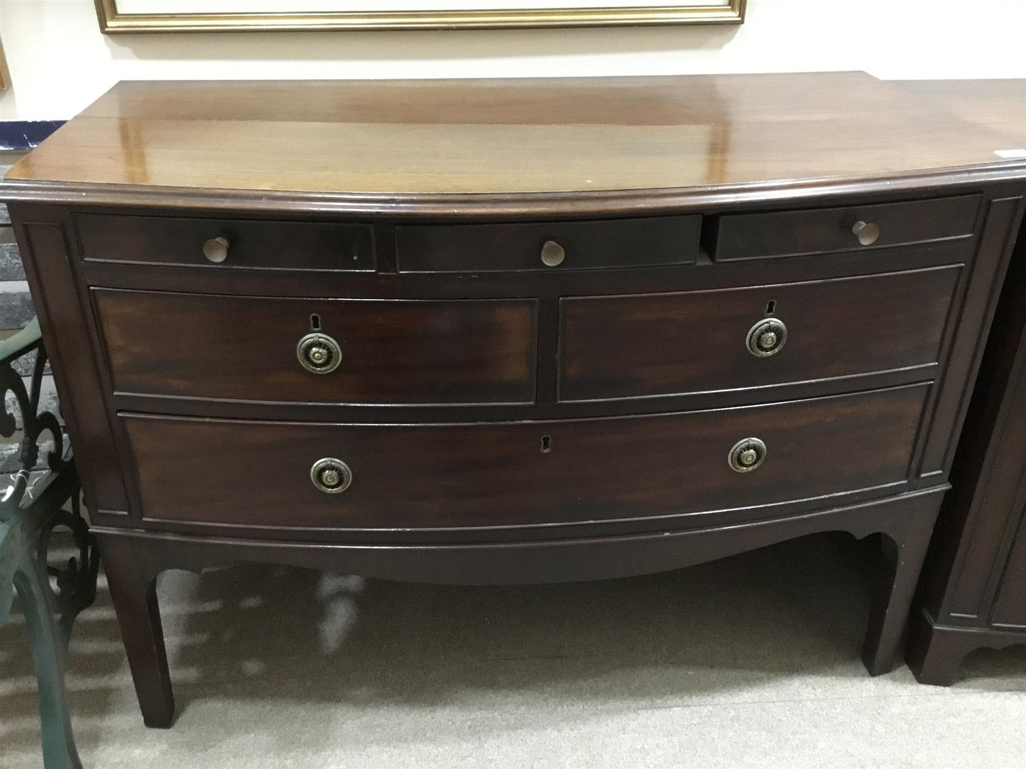A MAHOGANY BOW FRONT CHEST OF DRAWERS