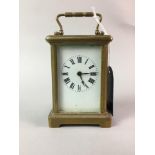 A SMALL CARRIAGE CLOCK