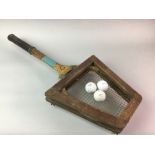 A VINTAGE TENNIS RACKET AND GOLF BALLS