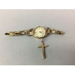 A LADY'S GOLD WRISTLET WATCH AND A GOLD CRUCIFIX