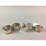 A SILVER PILL BOX AND FOUR SILVER NAPKIN RINGS