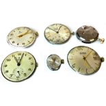 A COLLECTION OF VARIOUS WATCH DIALS AND MOVEMENTS