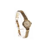 A LADY'S OMEGA GOLD WRIST WATCH