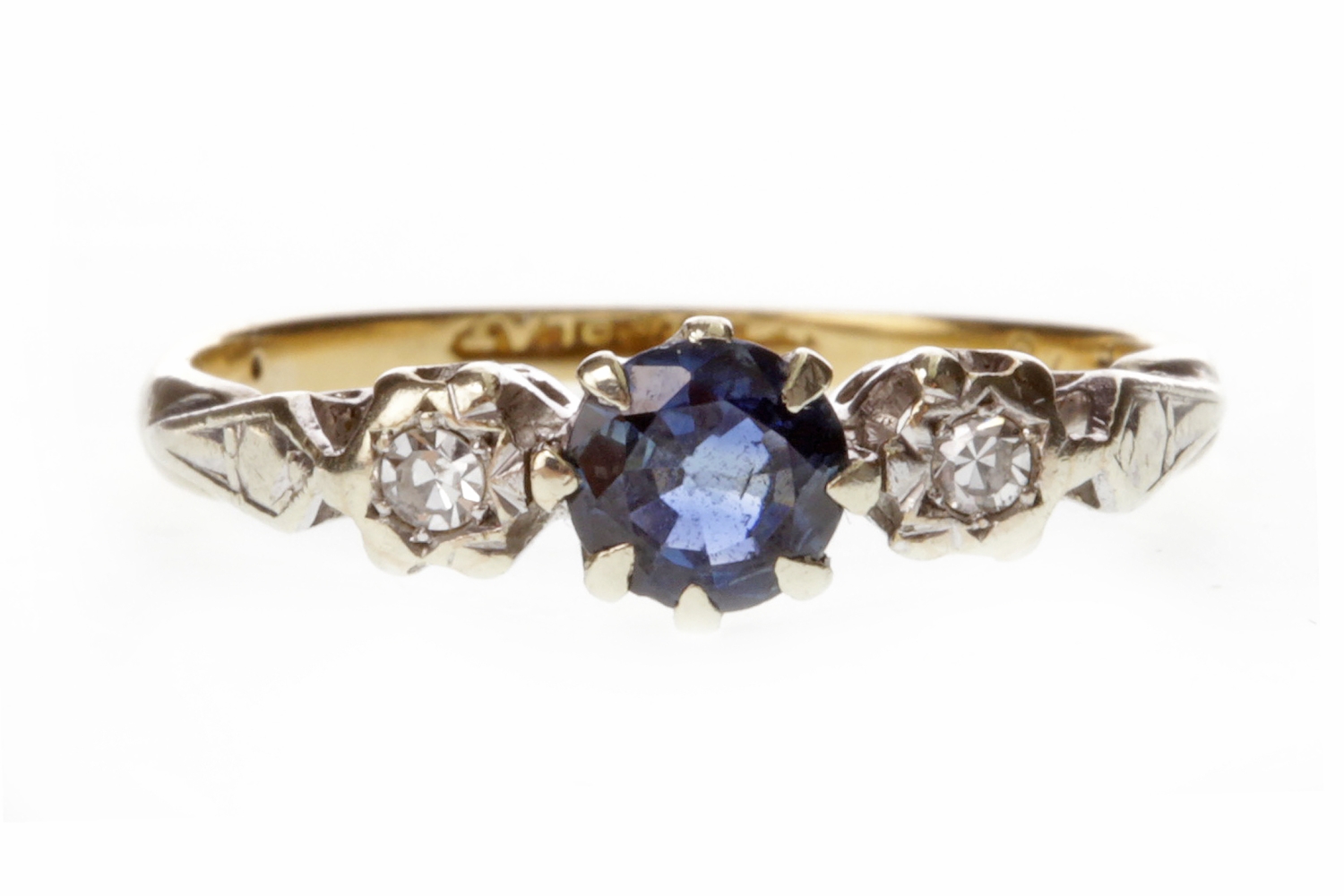 A GEM AND DIAMOND THREE STONE RING