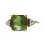 AN IMPRESSIVE DIAMOND AND GREEN GEM SET RING