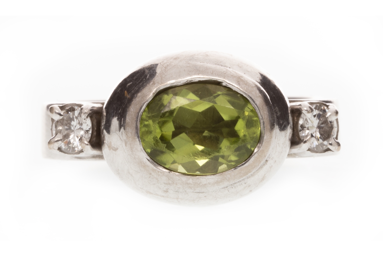 A DIAMOND AND GREEN GEM RING