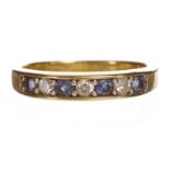 EIGHTEEN CARAT GOLD BLUE GEM AND DIAMOND SET HALF ETERNITY RING