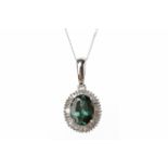 A GREEN GEM AND DIAMOND PENDANT