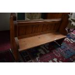 AN OLD PITCH PINE CHURCH BENCH