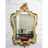 AN ATTRACTIVE CARTOUCHE-SHAPED PAINTED AND PARCEL GILT WALL MIRROR