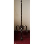 AN UNUSUAL CAST METAL AND WROUGHT IRON STANDARD LAMP