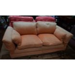 A SMALL ATTRACTIVE TWO-SEATER EASY SETTEE