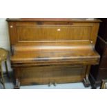 AN UPRIGHT IRON FRAME PIANO