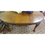 A CHIPPENDALE STYLE MAHOGANY TELESCOPIC DINING TABLE