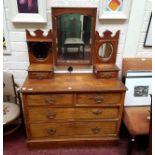 A GRAINED WALNUT DRESSING TABLE,