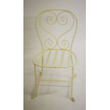 A SET OF FOUR PAINTED WROUGHT IRON PATIO GARDEN CHAIRS,