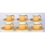 A SET OF SIX ROYAL CROWN DERBY GILT GADROONED APRICOT GROUND COFFEE CUPS AND SAUCERS, SAUCER 12.