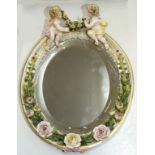 A SITZENDORF FLORAL ENCRUSTED OVAL MIRROR, 32CM H, UNDERGLAZE BLUE CROSSED LINES, LATE 19TH C