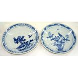 TWO CHINESE BLUE AND WHITE DISHES, SIMILARLY PAINTED WITH A BIRD ON A ROCK AMIDST PEONY OR